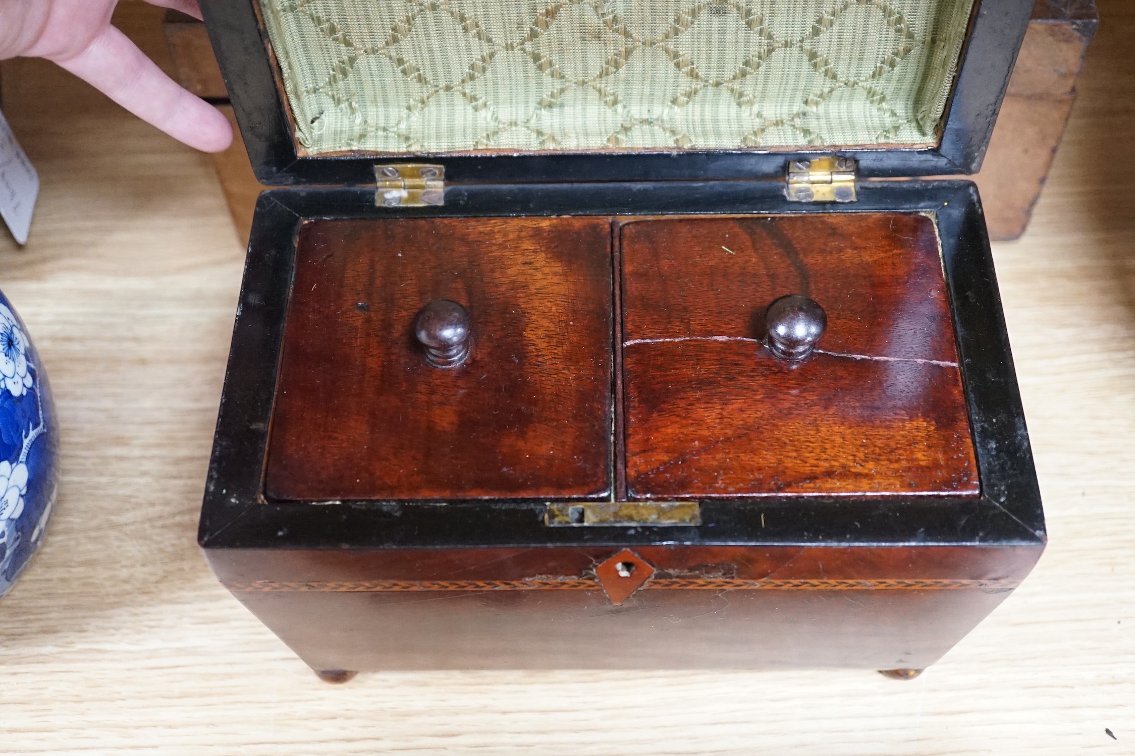 A 19th century mahogany tea caddy, writing slope, leather box and mantel clock, largest 30cm wide